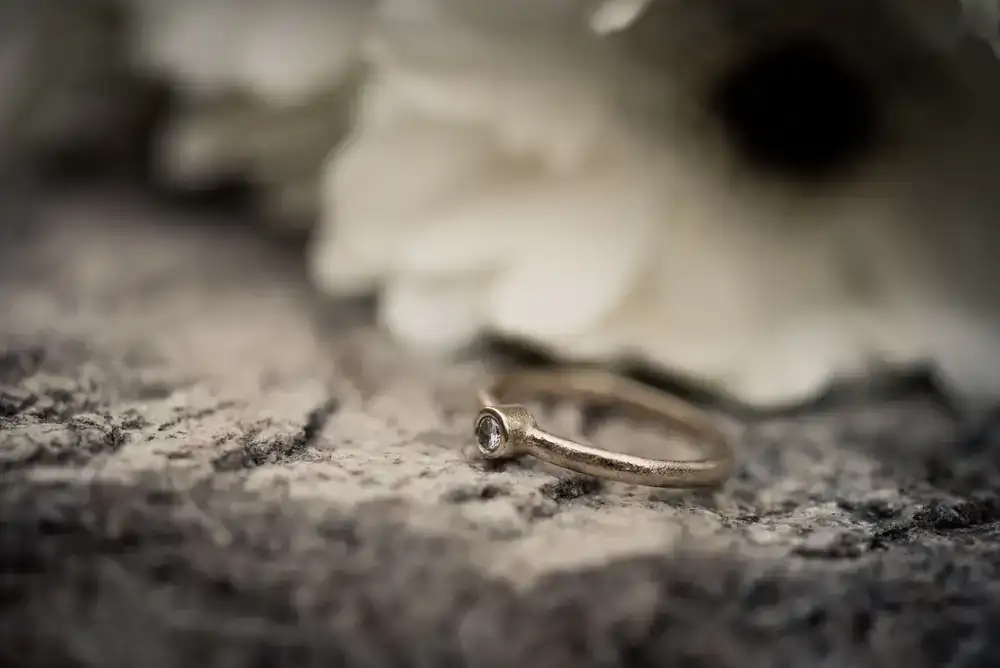 Close up of a handcrafted textured gold ring